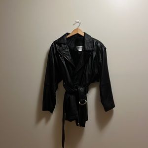 Black Leather Jacket. Belted and zippered front. By Marc Jacobs Size-medium